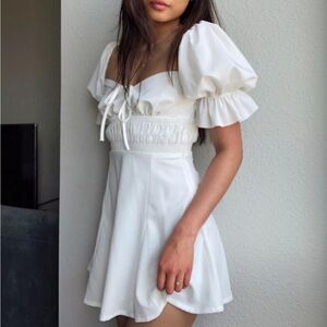 White mini dress with puff sleeves